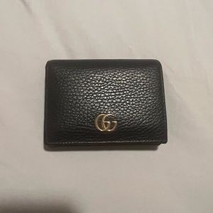Black Gucci wallet with coin area